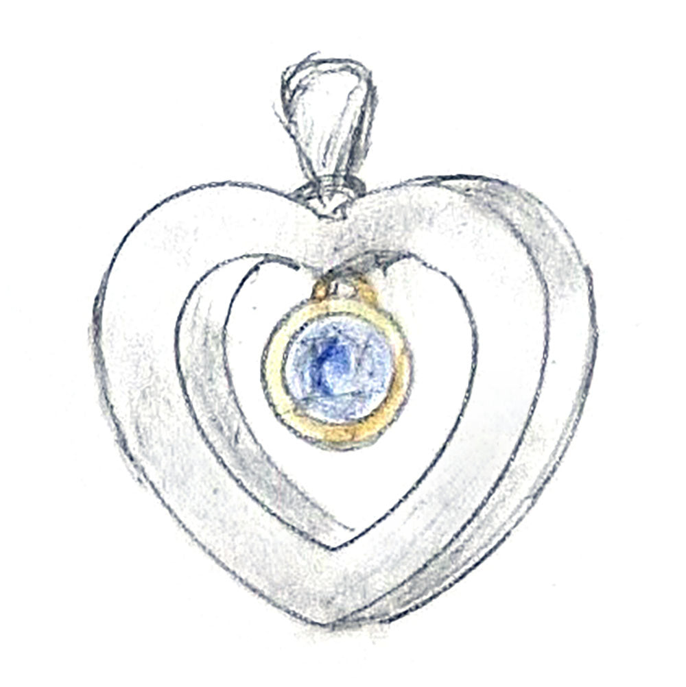 A heart-shaped pendant with concentric heart outlines in silver-toned metal, featuring a central oval gold bezel holding a blue gemstone, shown on a plain white background. Golden Snowdrop Shaftesbury Dorset