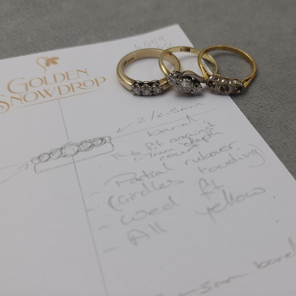 Hand drawn designs during our customer's bespoke consultation to make a Diamond Five Stone Eternity Style Ring In Yellow Gold, using our customer’s original gold and stones at Golden Snowdrop Jewellers in Shaftesbury, Dorset, near Salisbury. 