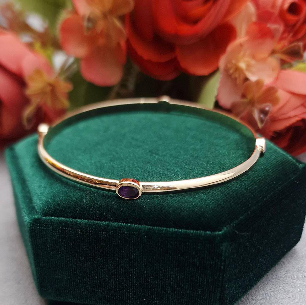 9ct Yellow Gold Amethyst Set Bangle. 
Bespoke design and hand made to our customer’s specifications, at Golden Snowdrop the jewellers in Shaftesbury near Fordingbridge. 
