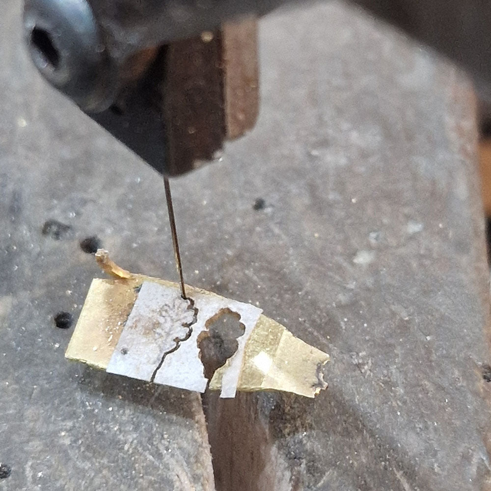 Handmade aspects of the Bespoke Diamond Solitaire Engagement Ring. Handmade in Platinum with 18ct Yellow Gold Oak leaf shoulders at Golden Snowdrop, the jewellers in Shaftesbury near Semley.