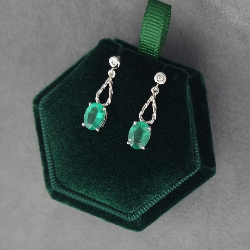 Bespoke Emerald and Diamond Platinum Drop Earrings. Handmade using our customers emeralds and diamonds at Golden Snowdrop the jewellers in Shaftesbury, near Wilton. 