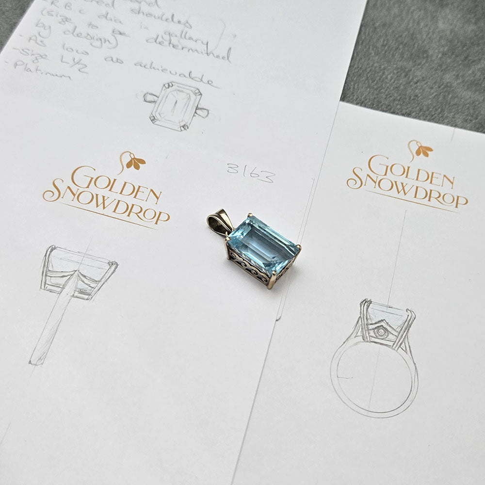 Aquamarine and Diamond Platinum Ring. 
CAD Design from pencil sketches to remodel our Customer’s Aquamarine pendant. 
Golden Snowdrop Jewellers in Shaftesbury Near Blandford Dorset.
