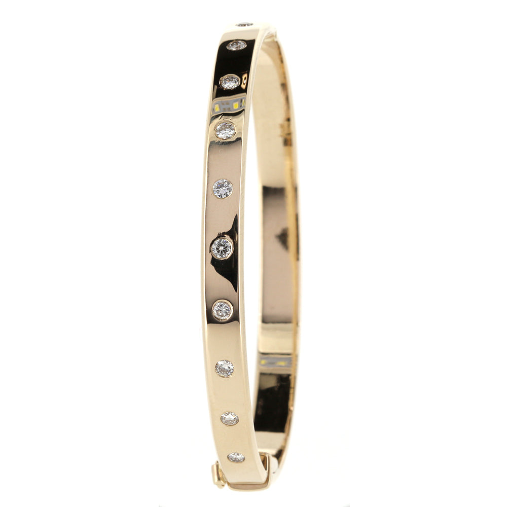 Bespoke Diamond and 9ct Gold Hinged Bangle using our customers Diamonds. Made and designed to our customers specifications at Golden Snowdrop, the jewellers in Shaftesbury near Tisbury. 
