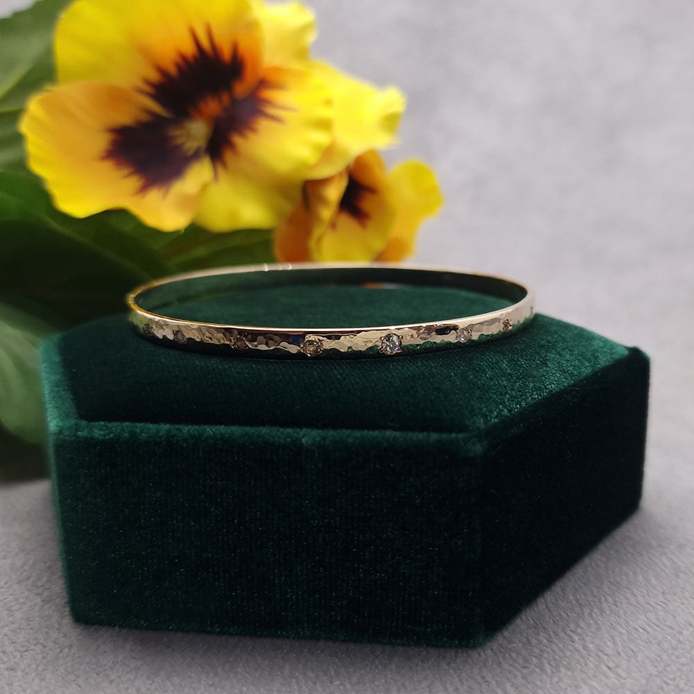 Bespoke Diamond and 9ct Yellow Gold Bangle with a Dappled, Hammered Finish. Made using our customers assorted gold at Golden Snowdrop the jewellers in Shaftesbury, near Stockbridge.