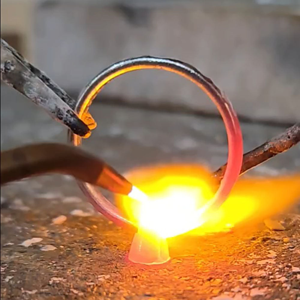 Part of the making process, soldering the bespoke Platinum head onto the Platinum band before the 18ct yellow Gold leaves were added and the Diamond was set. Made at Golden Snowdrop the jewellers in Shaftesbury, Dorset near Salisbury. 