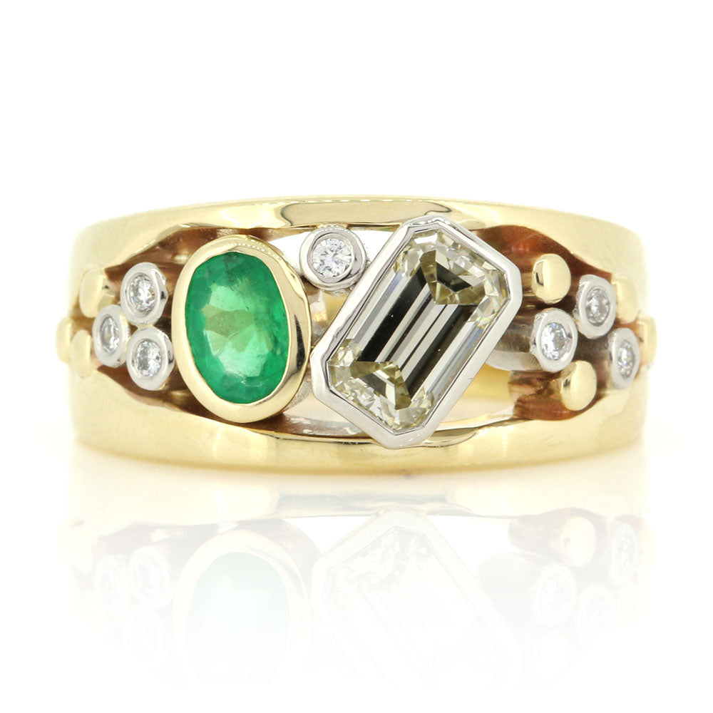Bespoke Diamonds and Emerald set in a 9ct Yellow Gold and Platinum Ring. Bespoke design made using our customer's Diamonds and Emerald at Golden Snowdrop Jewellers in Shaftesbury, Dorset near Sherborne. 