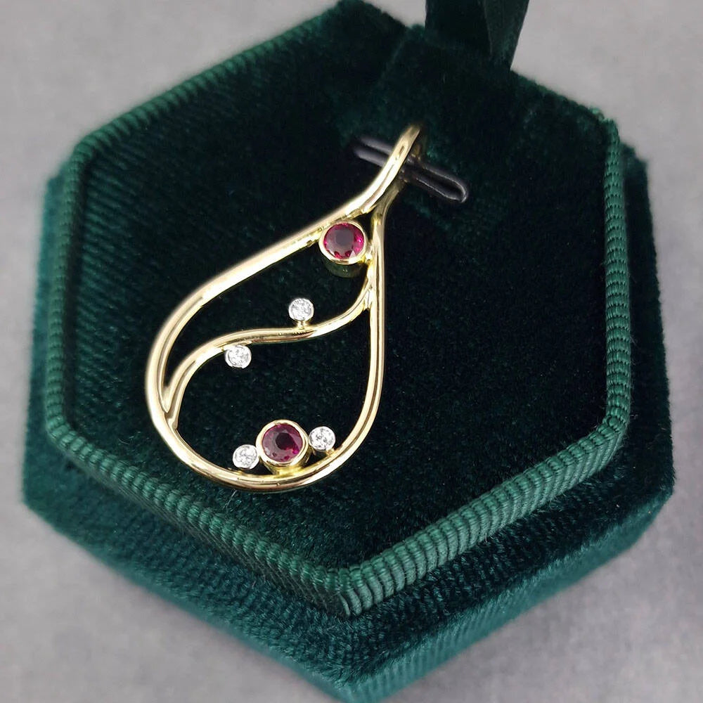 Bespoke re modeled ruby and diamond pendant and earring set by Golden Snwowdrop Jewellers in Shaftesbury Dorset