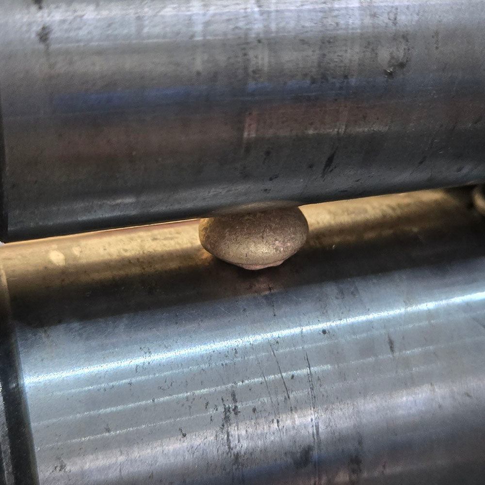 The rolling of the Diamond Set Organic Planished Pendant in 9ct Yellow Gold. Remodelled using our customers original gold at Golden Snowdrop, the jewellers in Shaftesbury near Chilmark 