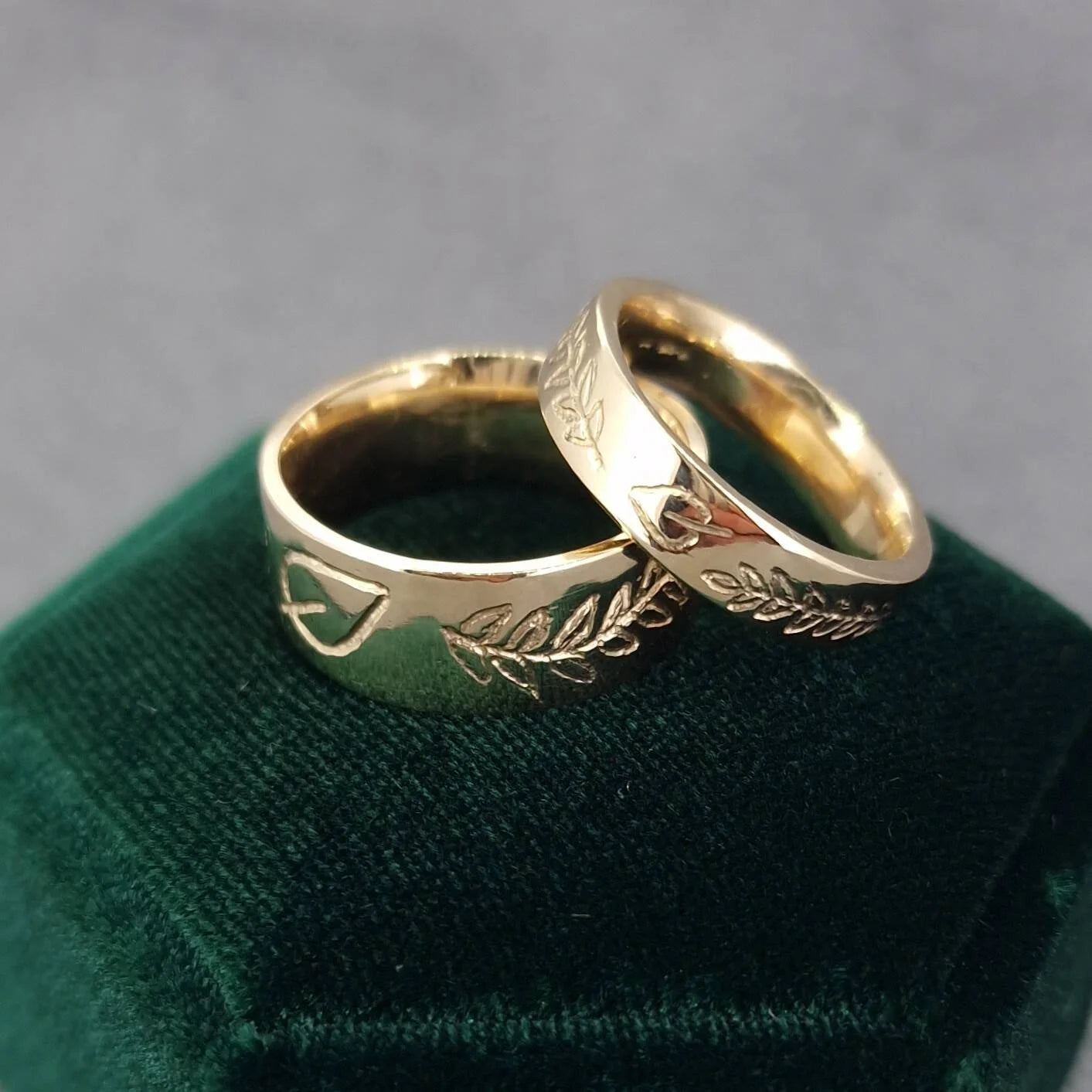 Bespoke remodelled wedding bands by golden snowdrop jewellerys handmade in 18ct yellow gold with leaf and engraving, at Golden Snowdrop the jewellers in Shaftesbury, near Tisbury. 