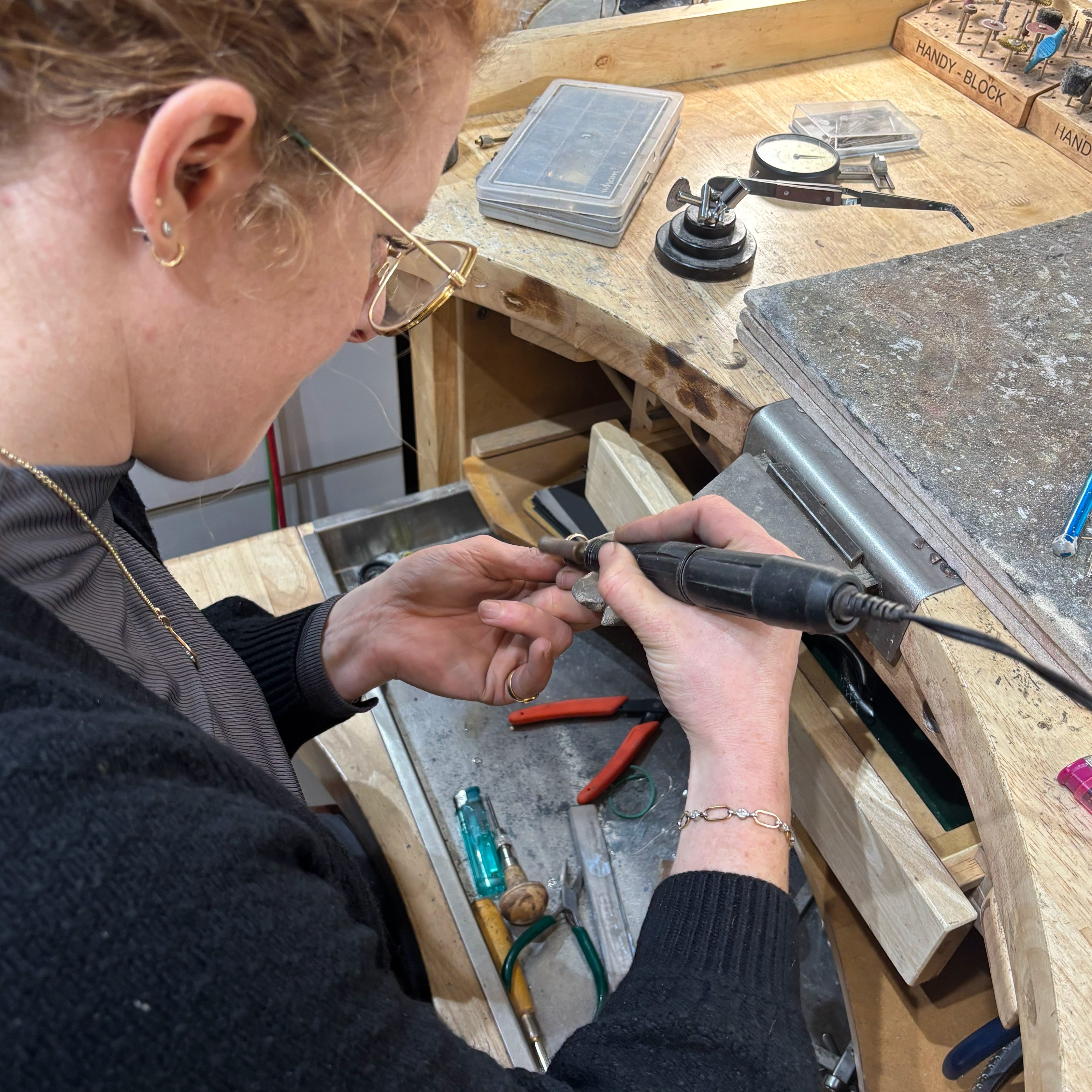 Hand finishing a yellow gold wedding ring  | Golden Snowdrop