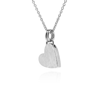 Sterling silver heart necklace showing dappled hammered finish | Golden Snowdrop