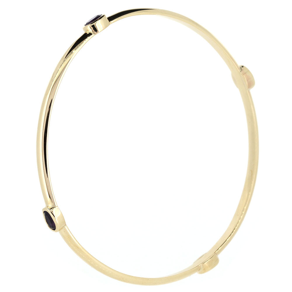 9ct Yellow Gold Amethyst Set Bangle. 
Bespoke design and hand made to our customer’s specifications, at Golden Snowdrop the jewellers in Shaftesbury near Wimborne. 