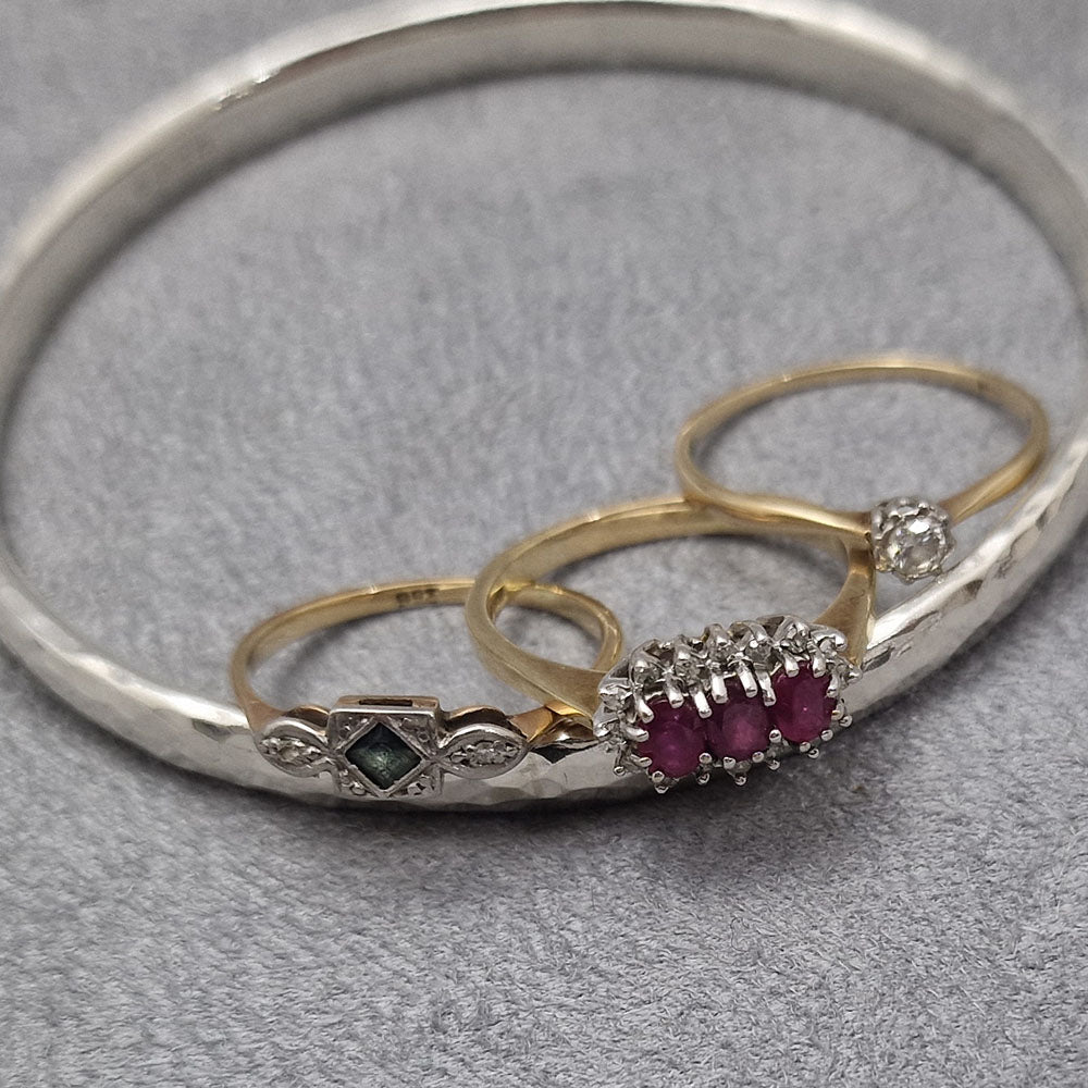 The insiration behind the bespoke Ruby, Sapphire and Diamond Hammered Bangle in Sterling Silver      with 9ct Yellow Gold Settings idea.  
Remodelled using our customers original gold and stones, at Golden Snowdrop the jewellers in Shaftesbury, near Dorchester. 
