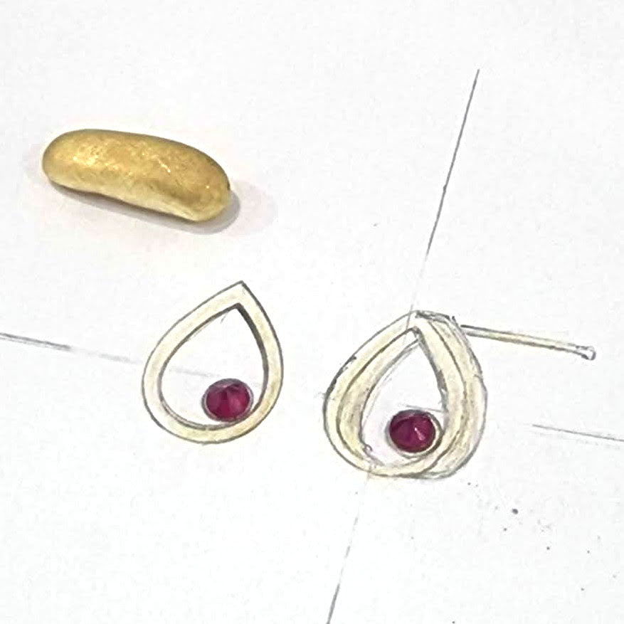 Hand-drawn design of the bespoke Ruby 18ct Yellow Gold Raindrop Stud Earrings during our customers first consultation with our jeweller, gemmologist and designer, Stephanie. Handmade from our Customer’s remodelled gold at Golen Snowdrop, the jewellers in Shaftesbury, near Downton. 