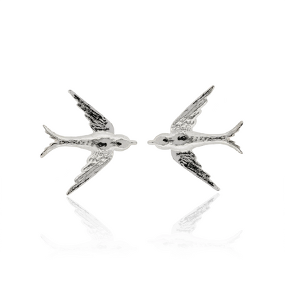 Silver bird-shaped earrings on a white background