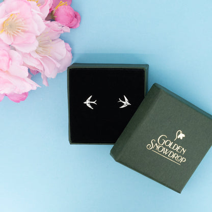 Small swallow stud earrings in sterling silver displayed in jewellery box | Golden Snowdrop
