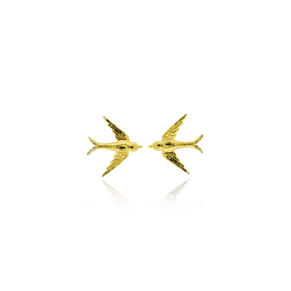 Gold bird-shaped earrings on a white background