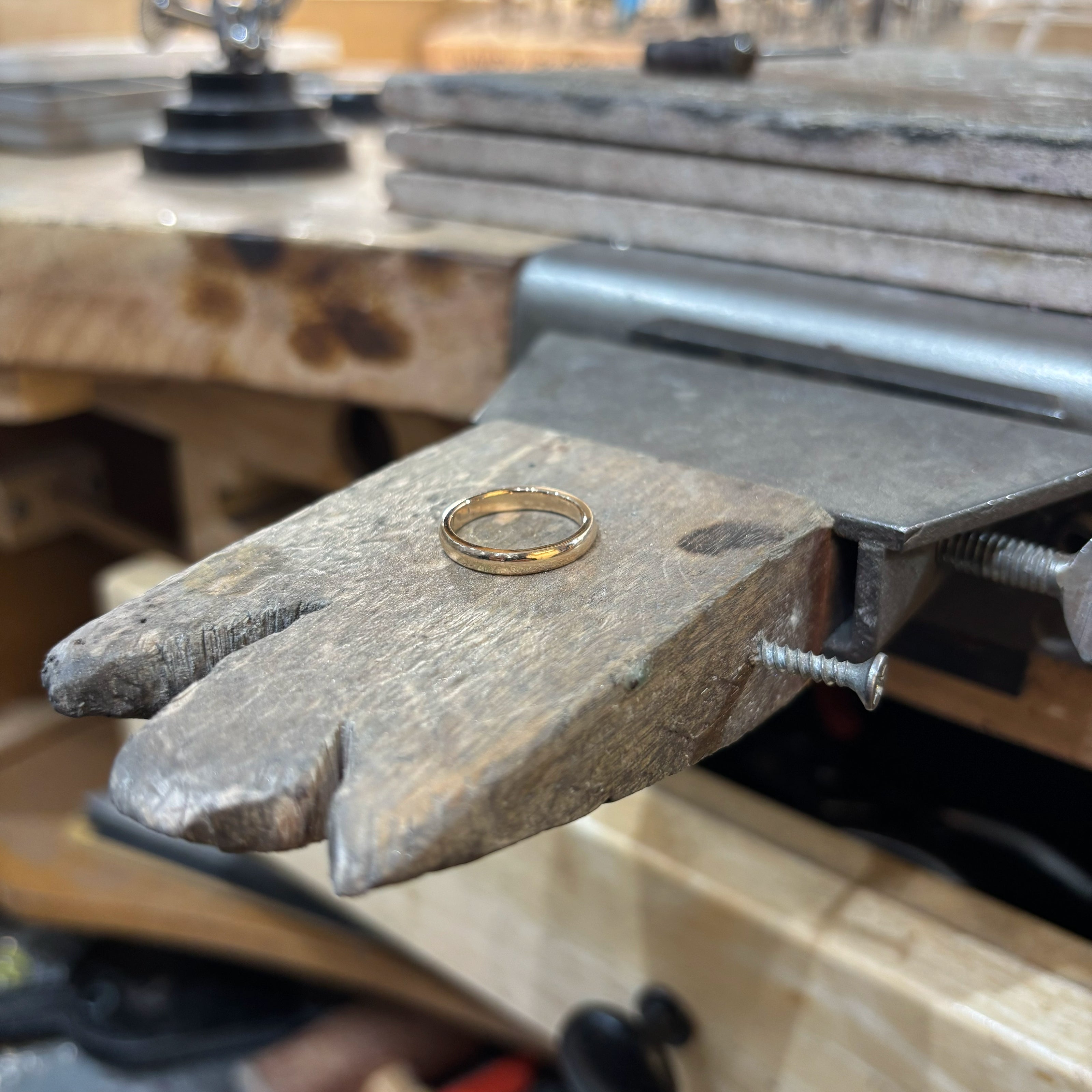 Yellow Gold wedding ring on work bench  | Golden Snowdrop