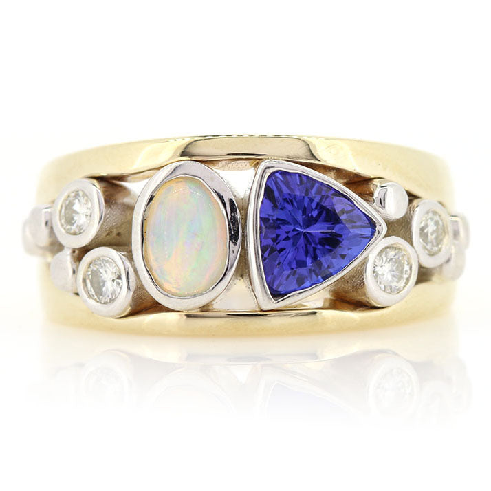 Bespoke Tanzanite, Opal And Diamond Yellow And White Gold Ring. Made using our customers opal and diamonds at Golden Snowdrop, the jewellers in Shaftesbury near Salisbury. 
