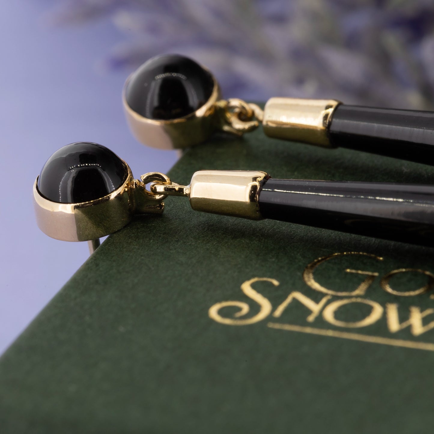 Black onyx drop earrings with gold cap and articulated link detail | Golden Snowdrop