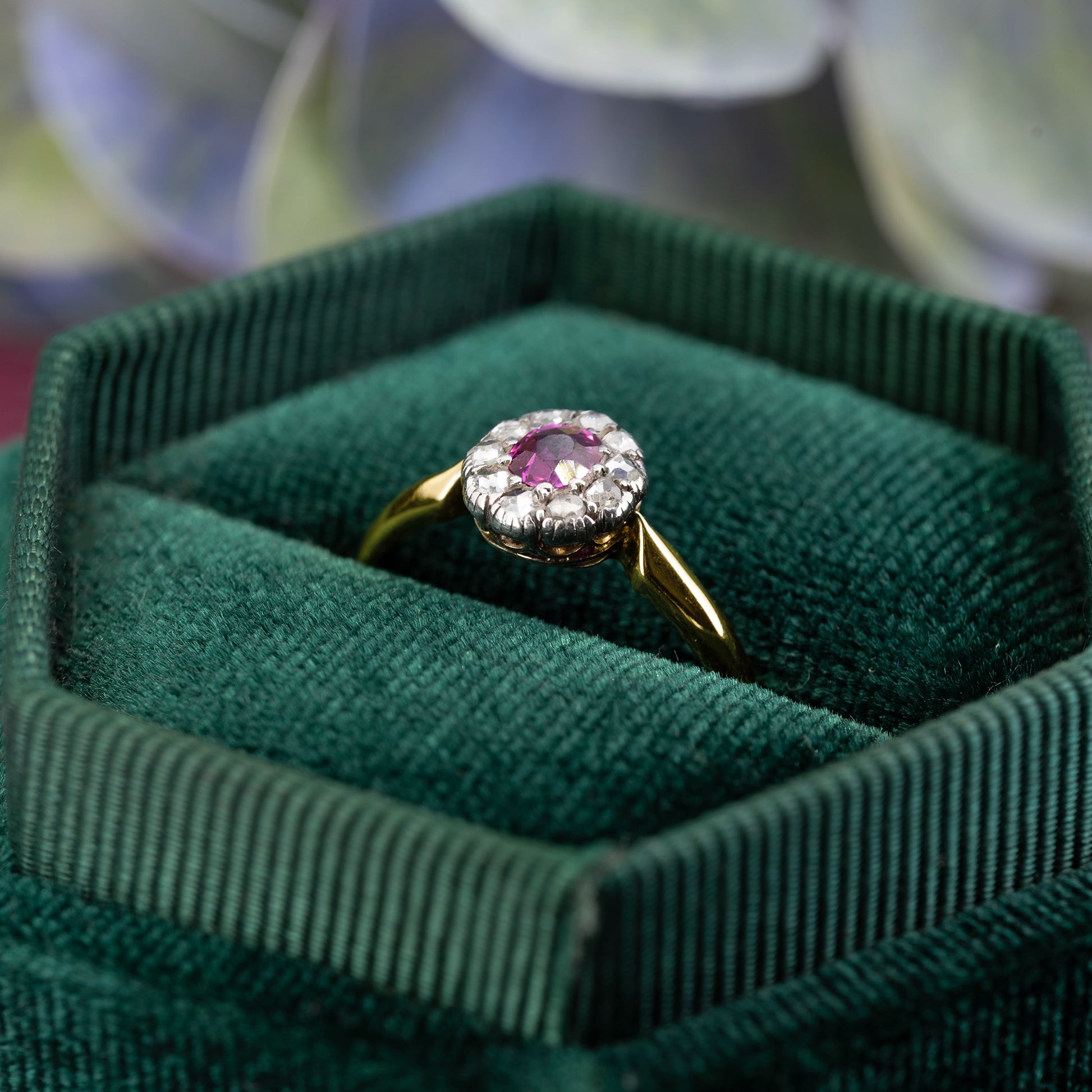Close up ruby centre stone with surrounding rose cut diamonds cluster | Golden Snowdrop